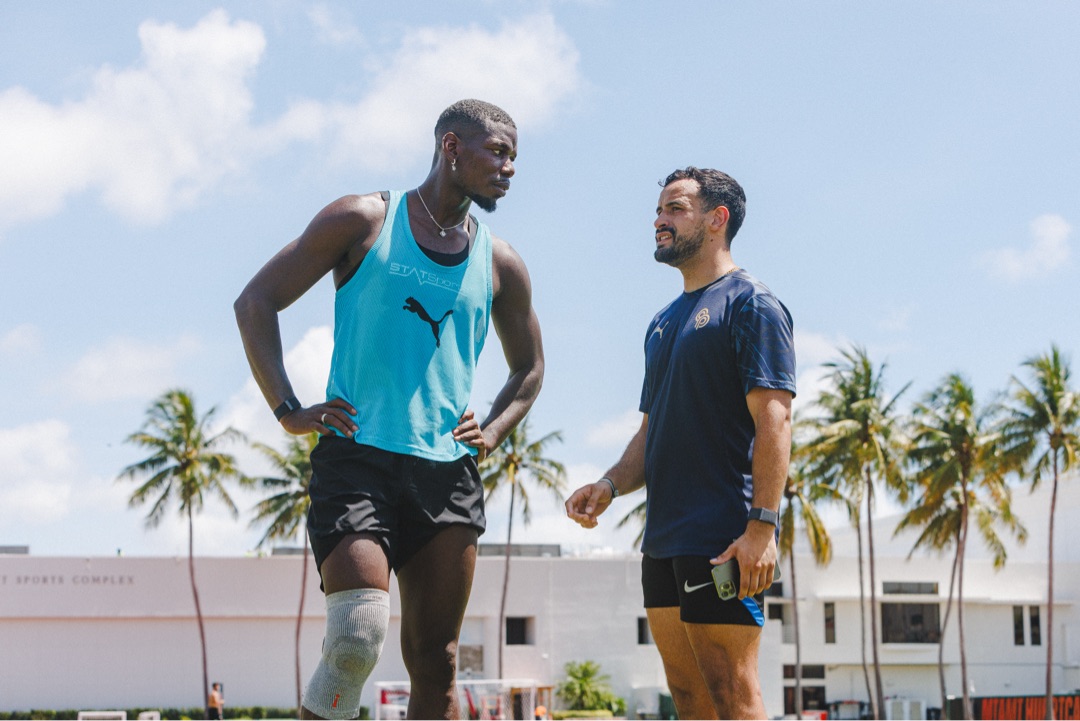 Roger Caibe training Paul Pogba on the field
