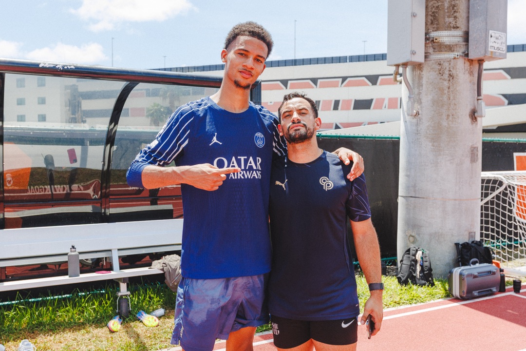 Roger with PSG player at training facility
