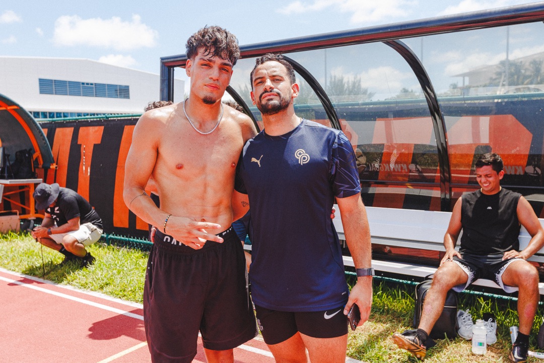 Roger with young athlete at training facility