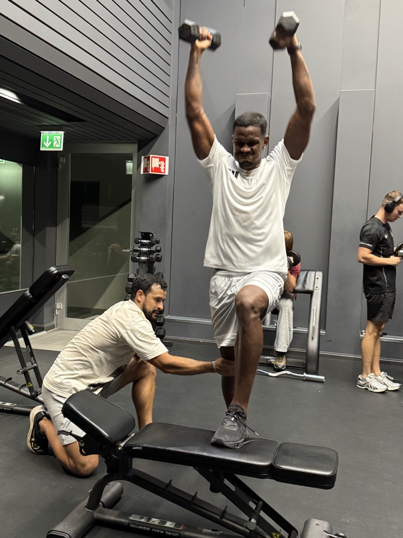 Roger coaching dumbbell exercises