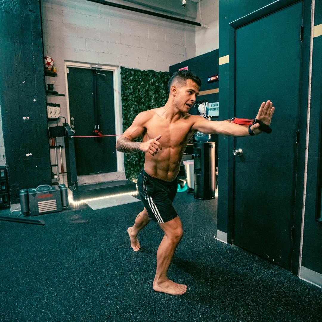 Athlete performing resistance band training at Crown